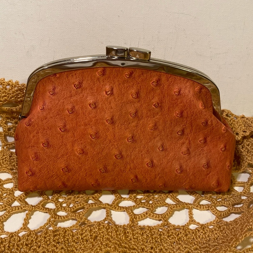 The Metropolitan kiss lock ostrich pattern cosmetic bag in sienna
